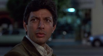Movie still from “Into the Night” (1985), directed by John Landis – A person wearing a jacket; Close Up shot, Low angle
