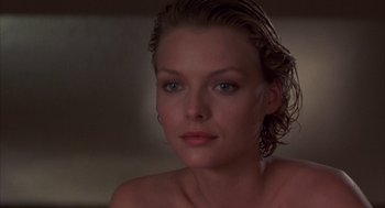 Movie still from “Into the Night” (1985), directed by John Landis – A person with wet hair; Close Up shot, Low angle