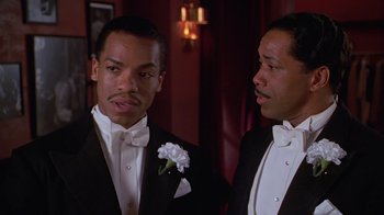 Movie still from “Introducing Dorothy Dandridge” (1999), directed by Martha Coolidge – Two men in tuxedos standing next to each other; Close Up shot, Low angle