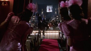 Movie still from “Introducing Dorothy Dandridge” (1999), directed by Martha Coolidge – A group of people standing in front of a stage; Wide shot, Low angle