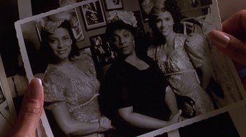 Movie still from “Introducing Dorothy Dandridge” (1999), directed by Martha Coolidge – A group of women posing for a picture in front of a wall; Close Up shot, Low angle