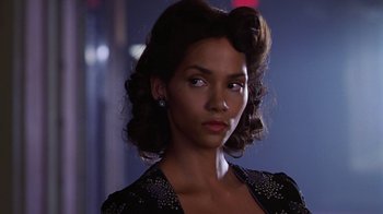 Movie still from “Introducing Dorothy Dandridge” (1999), directed by Martha Coolidge – A woman in a black dress with a black bow in her hair; Close Up shot, Low angle