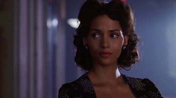 Movie still from “Introducing Dorothy Dandridge” (1999), directed by Martha Coolidge – A person wearing a dress; Close Up shot, Over the shoulder angle