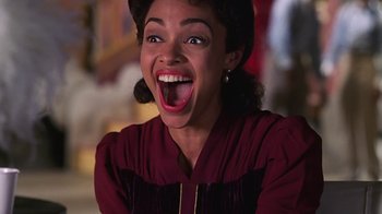 Movie still from “Introducing Dorothy Dandridge” (1999), directed by Martha Coolidge – An image of a woman that is smiling for the camera; Close Up shot, Low angle