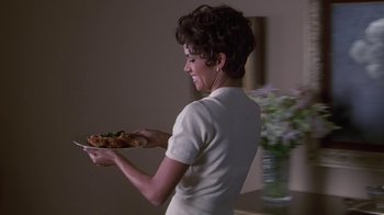 Movie still from “Introducing Dorothy Dandridge” (1999), directed by Martha Coolidge – A woman holding a plate of food in her hands; Medium shot, Low angle