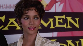 Movie still from “Introducing Dorothy Dandridge” (1999), directed by Martha Coolidge – A person wearing a dress; Close Up shot, Over the shoulder angle
