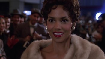 Movie still from “Introducing Dorothy Dandridge” (1999), directed by Martha Coolidge – A person wearing a fur coat; Close Up shot, Over the shoulder angle