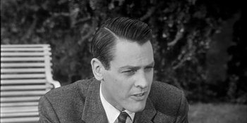 Movie still from “Invasion of the Body Snatchers” (1956), directed by Don Siegel – A man in a suit and tie looking to his left; Close Up shot, Low angle