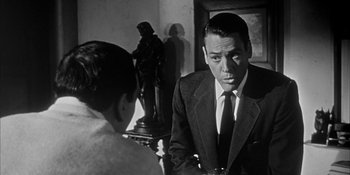 Movie still from “Invasion of the Body Snatchers” (1956), directed by Don Siegel – A black and white photo of a man and a woman; Close Up shot, Over the shoulder angle