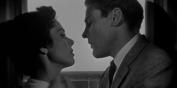 Movie still from “Invasion of the Body Snatchers” (1956), directed by Don Siegel – A man and a woman face to face in a black and white photo; Close Up shot, Low angle