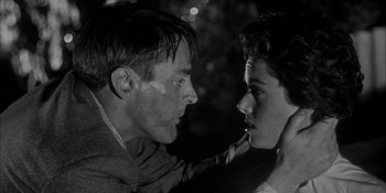 Movie still from “Invasion of the Body Snatchers” (1956), directed by Don Siegel – A man and a woman face to face in a black and white photo; Close Up shot, Low angle