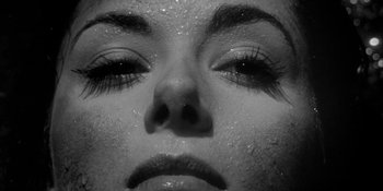 Movie still from “Invasion of the Body Snatchers” (1956), directed by Don Siegel – The face of a woman with eyes closed; Extreme Close Up shot, Overhead angle