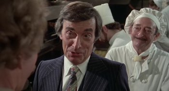 Movie still from “Invasion of the Body Snatchers” (1978), directed by Philip Kaufman – A person wearing a suit and tie; Close Up shot, Over the shoulder angle