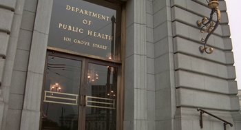 Movie still from “Invasion of the Body Snatchers” (1978), directed by Philip Kaufman – A department of public health sign on the side of a building; Wide shot, Low angle