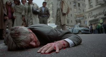 Movie still from “Invasion of the Body Snatchers” (1978), directed by Philip Kaufman – An old man laying on the ground covered in blood; Wide shot, High angle