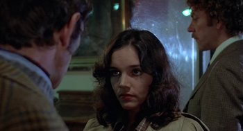 Movie still from “Invasion of the Body Snatchers” (1978), directed by Philip Kaufman – A young woman stares at a man in front of a mirror; Close Up shot, Over the shoulder angle