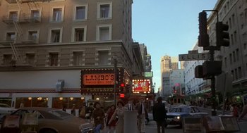 Movie still from “Invasion of the Body Snatchers” (1978), directed by Philip Kaufman – A crowd of people walking down a street next to tall buildings; Extreme Wide shot, High angle
