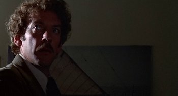 Movie still from “Invasion of the Body Snatchers” (1978), directed by Philip Kaufman – A person wearing a suit and tie; Close Up shot, Low angle