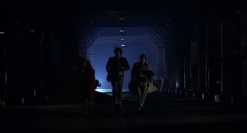 Movie still from “Invasion of the Body Snatchers” (1978), directed by Philip Kaufman – A group of people walking down a street at night; Wide shot, Low angle