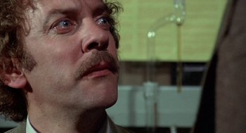 Movie still from “Invasion of the Body Snatchers” (1978), directed by Philip Kaufman – A person with a mustache; Close Up shot, Low angle
