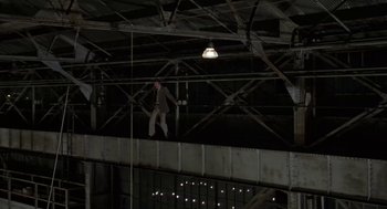 Movie still from “Invasion of the Body Snatchers” (1978), directed by Philip Kaufman – A man is jumping off a bridge at night; Wide shot, Overhead angle