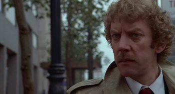 Movie still from “Invasion of the Body Snatchers” (1978), directed by Philip Kaufman – A person wearing a jacket; Close Up shot, Low angle