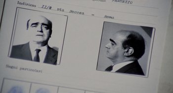 Movie still from “Investigation of a Citizen Above Suspicion” (1970), directed by Elio Petri – A black and white photo of a man's face and head; Extreme Close Up shot, Low angle