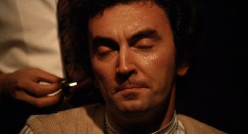 Movie still from “Investigation of a Citizen Above Suspicion” (1970), directed by Elio Petri – A person with his eyes closed; Close Up shot, High angle