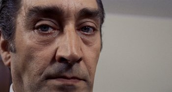 Movie still from “Investigation of a Citizen Above Suspicion” (1970), directed by Elio Petri – A man's eyes and nose; Extreme Close Up shot, Low angle