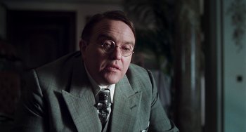 Movie still from “Invincible” (2001), directed by Werner Herzog – An older man in a suit and tie; Close Up shot, Low angle