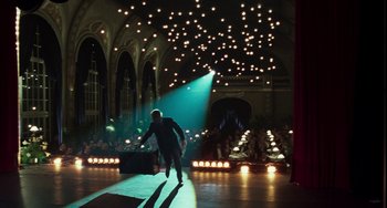 Movie still from “Invincible” (2001), directed by Werner Herzog – A man walking on a runway in a dark room; Extreme Wide shot, Low angle