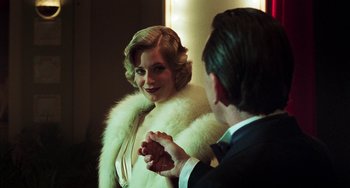 Movie still from “Invincible” (2001), directed by Werner Herzog – A man and a woman are dressed up for a formal event; Close Up shot, Over the shoulder angle