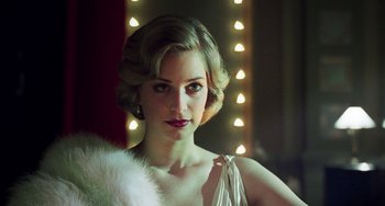 Movie still from “Invincible” (2001), directed by Werner Herzog – A woman in a white dress and a white fur stole; Close Up shot, Low angle