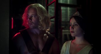 Movie still from “Invincible” (2001), directed by Werner Herzog – A man and a woman standing next to each other; Close Up shot, Low angle