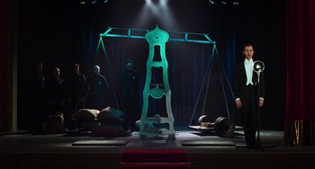 Movie still from “Invincible” (2001), directed by Werner Herzog – A stage set with a large metal object on top of it; Wide shot, Low angle