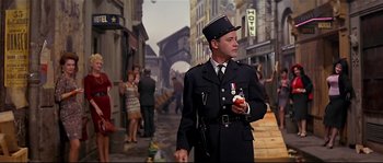 Movie still from “Irma la Douce” (1963), directed by Billy Wilder – A man in a uniform holding an ice - cream cone; Medium shot, Low angle