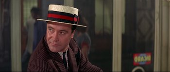 Movie still from “Irma la Douce” (1963), directed by Billy Wilder – A person wearing a hat; Close Up shot, Low angle