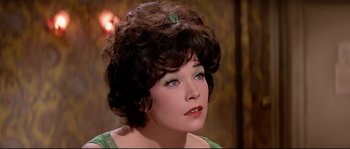 Movie still from “Irma la Douce” (1963), directed by Billy Wilder – A person wearing a green dress; Close Up shot, High angle