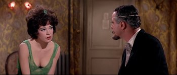 Movie still from “Irma la Douce” (1963), directed by Billy Wilder – A man and a woman are talking in a room; Close Up shot, Over the shoulder angle