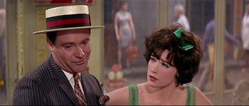Movie still from “Irma la Douce” (1963), directed by Billy Wilder – A man and a woman sitting next to each other; Close Up shot, Over the shoulder angle