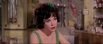 Movie still from “Irma la Douce” (1963), directed by Billy Wilder – A person wearing a green dress; Close Up shot, Over the shoulder angle
