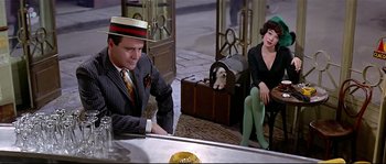 Movie still from “Irma la Douce” (1963), directed by Billy Wilder – A man and a woman sitting in front of a mirror; Medium shot, High angle