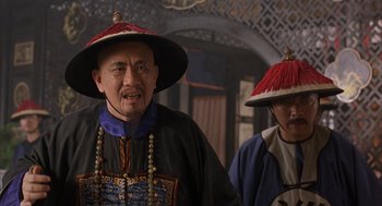 Movie still from “Iron Monkey” (1993), directed by Woo-Ping Yuen – Two men in traditional chinese garb are walking; Close Up shot, Over the shoulder angle