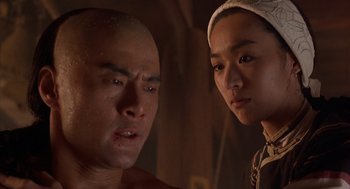 Movie still from “Iron Monkey” (1993), directed by Woo-Ping Yuen – A man and a woman standing next to each other in a room; Close Up shot, Low angle