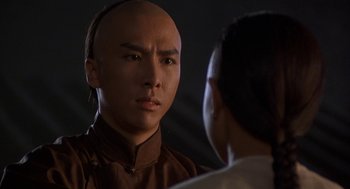 Movie still from “Iron Monkey” (1993), directed by Woo-Ping Yuen – A man with a bald head looking into a mirror; Close Up shot, Over the shoulder angle