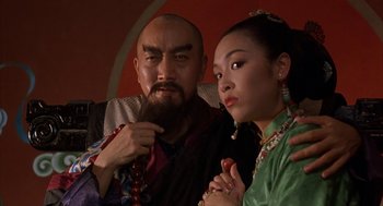 Movie still from “Iron Monkey” (1993), directed by Woo-Ping Yuen – A man and a woman pose for a picture; Close Up shot, Low angle