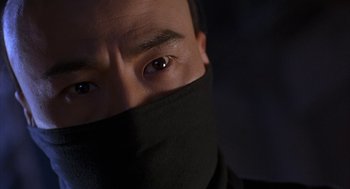 Movie still from “Iron Monkey” (1993), directed by Woo-Ping Yuen – A person wearing a black mask; Close Up shot, Low angle