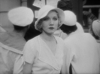 Movie still from “Island of Lost Souls” (1932), directed by Erle C. Kenton – An old photo of a woman wearing a white hat; Close Up shot, High angle