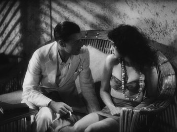 Movie still from “Island of Lost Souls” (1932), directed by Erle C. Kenton – A man and a woman sitting on a bench; Medium shot, High angle