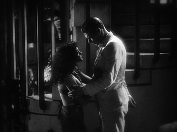 Movie still from “Island of Lost Souls” (1932), directed by Erle C. Kenton – A black and white photo of a man and a woman; Medium shot, Low angle